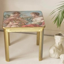 Gold side table with cherubs